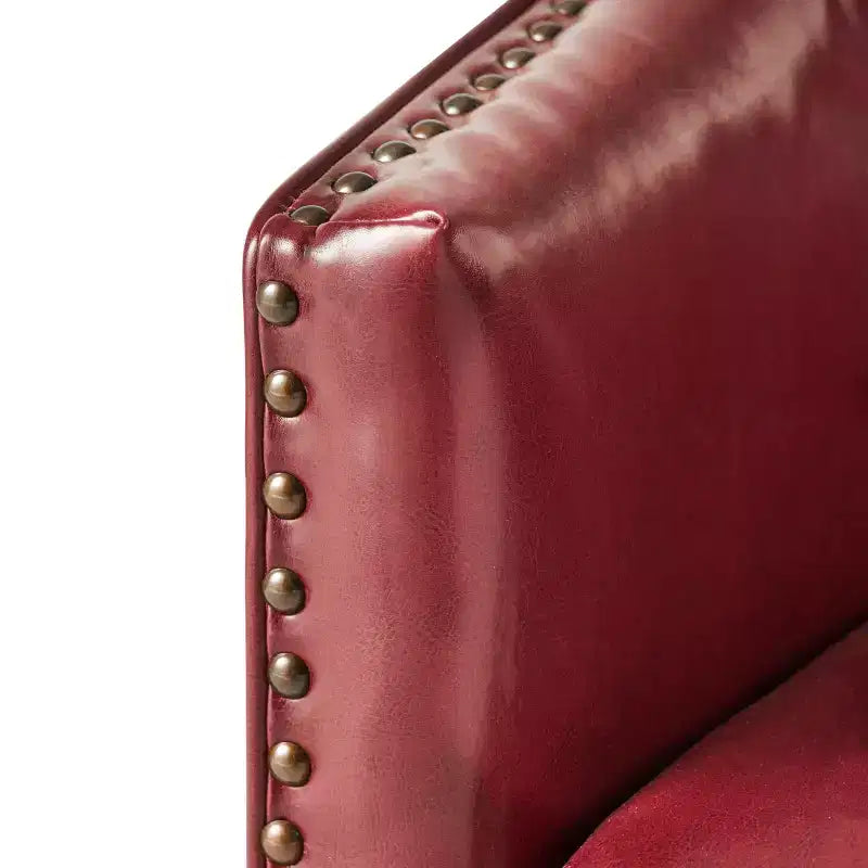 Poltrona club imbottita con finiture borchiate, colori assortiti, 1 posto