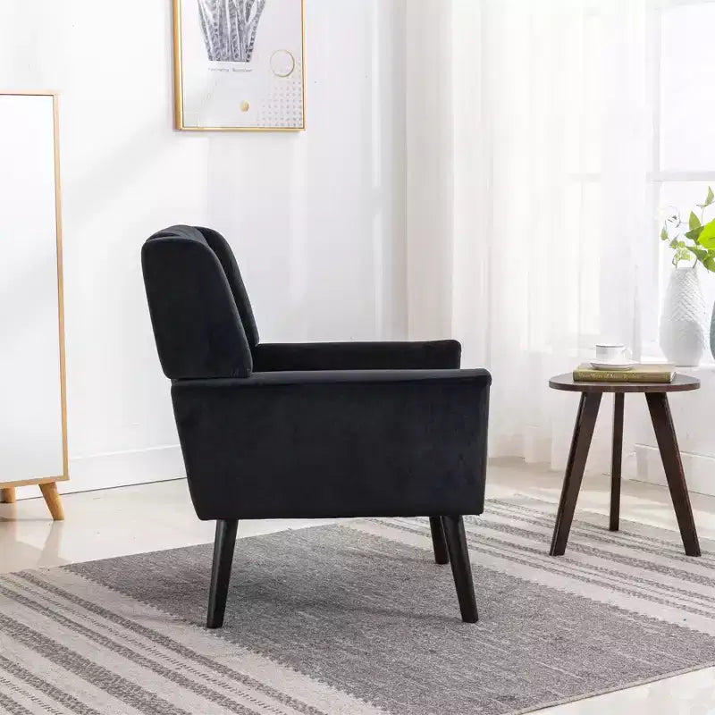 Poltrona d'accento in velluto grigio con braccioli, seduta singola, gambe in legno nero