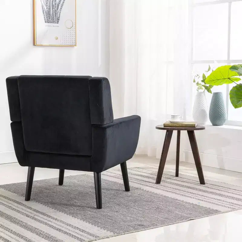 Poltrona d'accento in velluto grigio con braccioli, seduta singola, gambe in legno nero