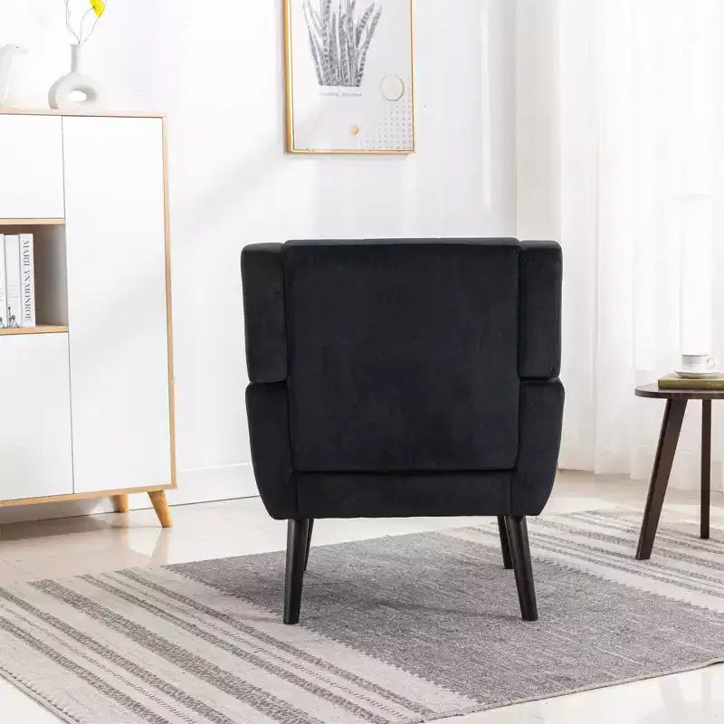 Poltrona d'accento in velluto grigio con braccioli, seduta singola, gambe in legno nero